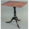 Image 1 : A George III mahogany rectangular top occasional table, on baluster stem and tripod, 2ft.4ins....