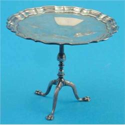 An Edwardian miniature silver tea table, with piecrust top and tripod base, 3,.75ins. Makers Gold...