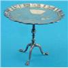 Image 1 : An Edwardian miniature silver tea table, with piecrust top and tripod base, 3,.75ins. Makers Gold...