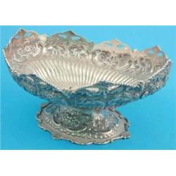 A Victorian Scottish silver fruit bowl, with flower and scroll decoration, later adapted and re-h...