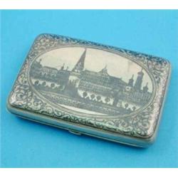 A Russian 84 zolotnik and niello cigarette case, decorated with a view of St. Petersburg?, 4ins....