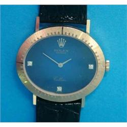 A gentleman's 18ct gold Rolex Cellini, with oval case, diamond set blue dial and black crocodile...