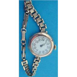 A lady's 9ct gold Rolex wrist watch with enamelled arabic dial, 1915....