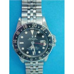 A gentleman's steel Rolex Oyster Perpetual GMT-Master wrist watch, with blued bezel and black dia...