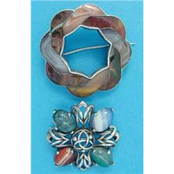A Scottish silver openwork brooch, set 4 oval agates, together with a Scottish open circle pebble...
