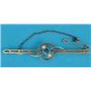 Image 1 : A 15ct gold openwork bar brooch, millegrain set with a square sapphire flanked by split pearls...