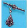 Image 1 : A gilt metal pear shape pendant, pave-set garnets, together with a similar bar brooch...
