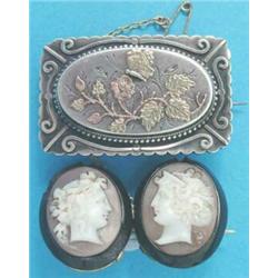 A Victorian silver rectangular brooch, with 2-colour gold floral decoration, the reverse with gla...