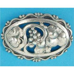 A Georg Jensen sterling silver openwork oval brooch, depicting berries and leaves, No.177A...
