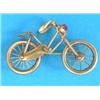 Image 1 : A 15ct gold brooch, in the form of a bicycle, the headlamp set with a red stone...
