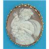 Image 1 : An oval shell cameo brooch, carved with a baccante, in 9ct gold beaded and scrolled frame, 2ins...