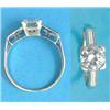 Image 1 : A white gold solitaire diamond ring, the claw set brilliant cut diamond flanked by baguette cut d...