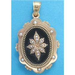 A 19th century French gold pendant locket, the front applied with a seed pearl flowerhead within...