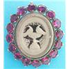 Image 1 : A Victorian gilt metal swivel portrait brooch, the frame set amethyst coloured pastes...
