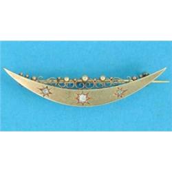 A Victorian gold crescent moon brooch, gypsy set 3 diamonds...