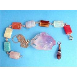 A carved amethyst pendant, in the form of a fish, a flexible bracelet of 8 rectangular specimen h...