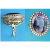 Image 1 : An 18ct gold dress ring, set with a large oval amethyst bordered by seed pearls...