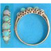 Image 1 : A 9ct gold half hoop ring, claw set 5 round opals...