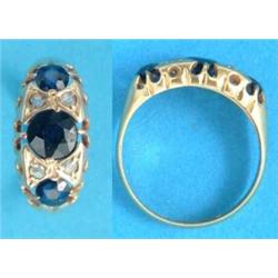 An 18ct gold ring, set 3 sapphires spaced by 2 pairs of rose cut diamonds...