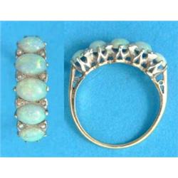 An 18ct gold half hoop ring, set 5 oval opals and seed pearls...