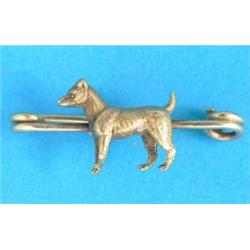 A gold 'terrier' tie pin...