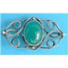Image 1 : An Art Nouveau silver openwork brooch, set with an oval cabochon chrysophase...