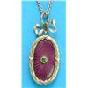 Image 1 : A small Edwardian 2-colour gold oval pendant, with purple guilloche enamelling in a laurel wreath...