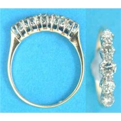 A gold claw-set 5-stone diamond half hoop ring...