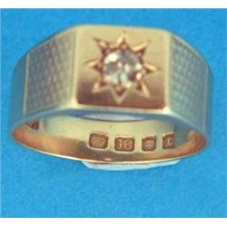 A gentleman's Art Deco 18ct gold ring, gypsy set with a single diamond, engine turned shoulders...