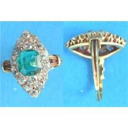 A Victorian 18ct gold marquise cluster ring, pave set with a central rectangular emerald and 16 o...