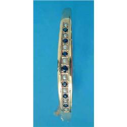 A 9ct gold Victorian design hinged bangle, the front set with a graduated line of alternating sap...