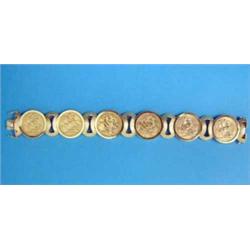 A sovereign bracelet, the 6 sovereigns (1901-1915) in 18ct textured gold mount, total weight appr...