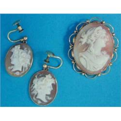 A pair of shell cameo drop earrings, each carved with a classical female profile in 9ct gold rub...