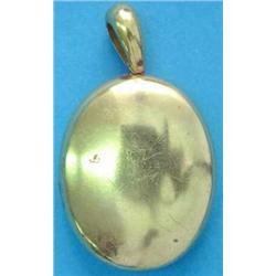 A Victorian plain gold oval pendant locket...
