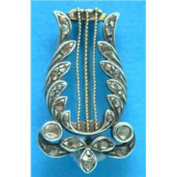 A 19th century gold lyre shape brooch, set rose cut diamonds...