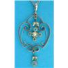 Image 1 : An Edwardian 9ct gold pendant, of openwork scroll design set aquamarines and seed pearls on fine...