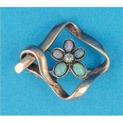 An Edwardian 15ct gold brooch, with a central opal and diamond set flowerhead...