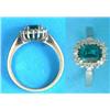 Image 1 : An 18ct white gold ring, set with a rectangular cut synthetic emerald and white stones...