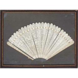 A 19th century Chinese fan, having carved, pierced ivory guards, the carved ivory sticks depictin...