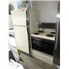 Image 1 : GE electric stove & fridge - used