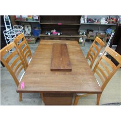 Wood dining room table w/ leaf & 4 chairs