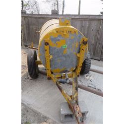 yellow water tank on 2 wheel trailer