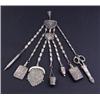 A late Victorian plated chatelaine, circa 1895, pierced and cast in Indian style with seven chain...