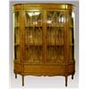 Image 1 : A late Victorian satinwood and rosewood astragal glazed china cabinet, circa 1895, with convex ri...