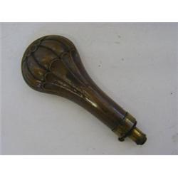 A FOLIAGE IMPRESSED BRASS PRIMING FLASK, with spring nozzle, together with a plain copper bodied...