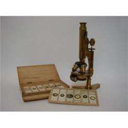 A R & J BECK MICROSCOPE, early 20th century, No.11609, with lens accessories and labelled specime...