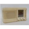 Image 1 : A 'LITTLE MAESTRO' CREAM BAKELITE WIRELESS, 1940's, width 30cm       £30-50...