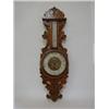 Image 1 : AN OAK WHEEL BAROMETER, late 19th century, elaborately carved case, thermometer over registar dia...