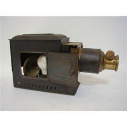 A TINPLATE AND BRASS MAGIC LANTERN, first half of the 20th century (incomplete)  £20-30...