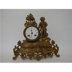 A CAST METAL MANTEL CLOCK, late 19th century, figure and scroll, 8cm enamel Roman dial, height 29...